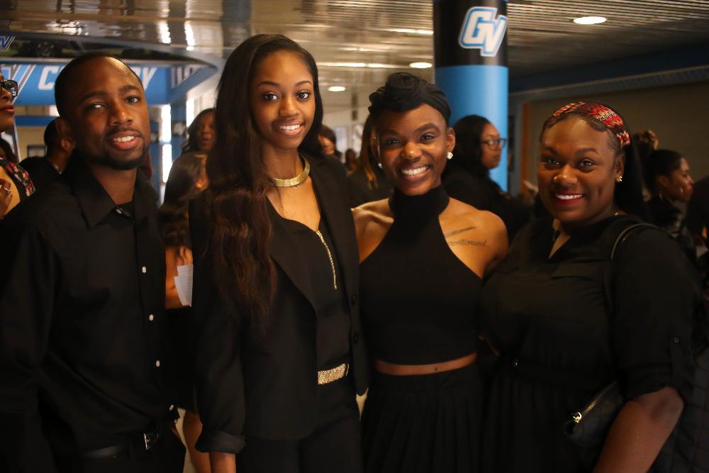 Black student graduates smiling
